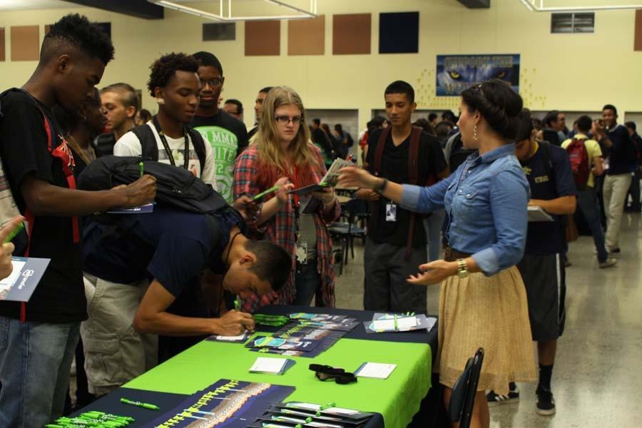 Seniors interested in transferring credits to NAU, ASU, or UofA filled out forms to receive more information and conversed with a representative.