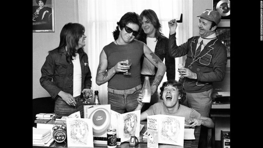 UNITED KINGDOM -circa 1976. Malcolm Young, Bon Scott, Mark Evans, manager Michael Browning and Angus Young.  (Photo by Dick Barnatt/Redferns)