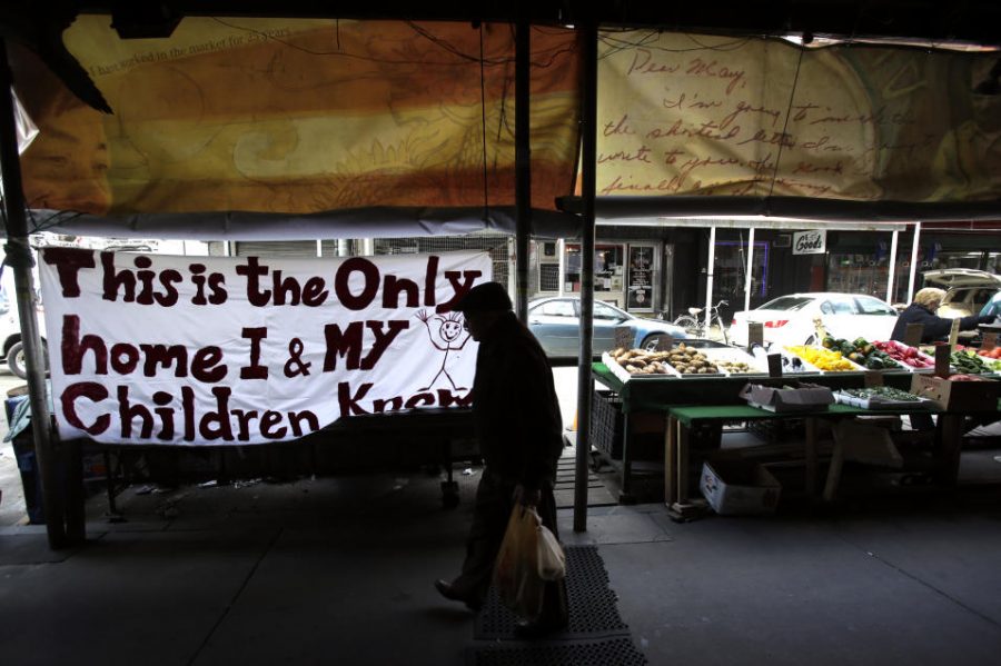 A Immigrant puts a big sign up to protest.