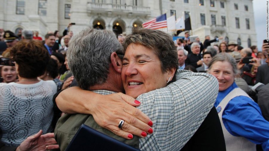 Image #: 22200211    Senator Donna Nesselbush (R) embraces a supporter after the Marriage Equality Act was signed into law at the State House in Providence, Rhode Island, May 2, 2013. Rhode Island became the 10th U.S. state to extend marriage rights to same-sex couples. REUTERS/Jessica Rinaldi (UNITED STATES - Tags: POLITICS SOCIETY)       REUTERS /JESSICA RINALDI /LANDOV