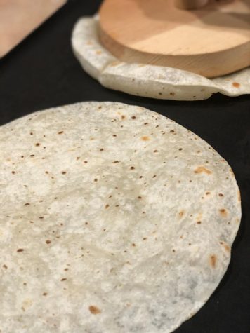 Tortillas being heated, causing them to greatly bubble