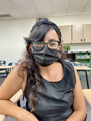 Mrs. Rivera, an English teacher at La Joya Community High School sits down facing the camera with a mask on for an interview about the rising coronavirus cases in school.