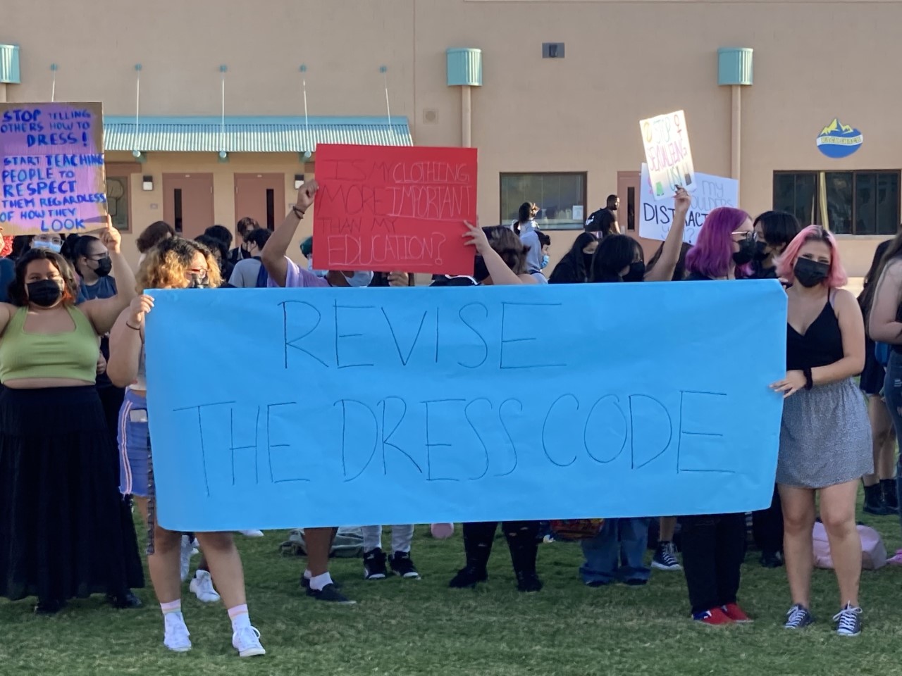 Group of High Schoolers Holding a Blue Feminism Sign