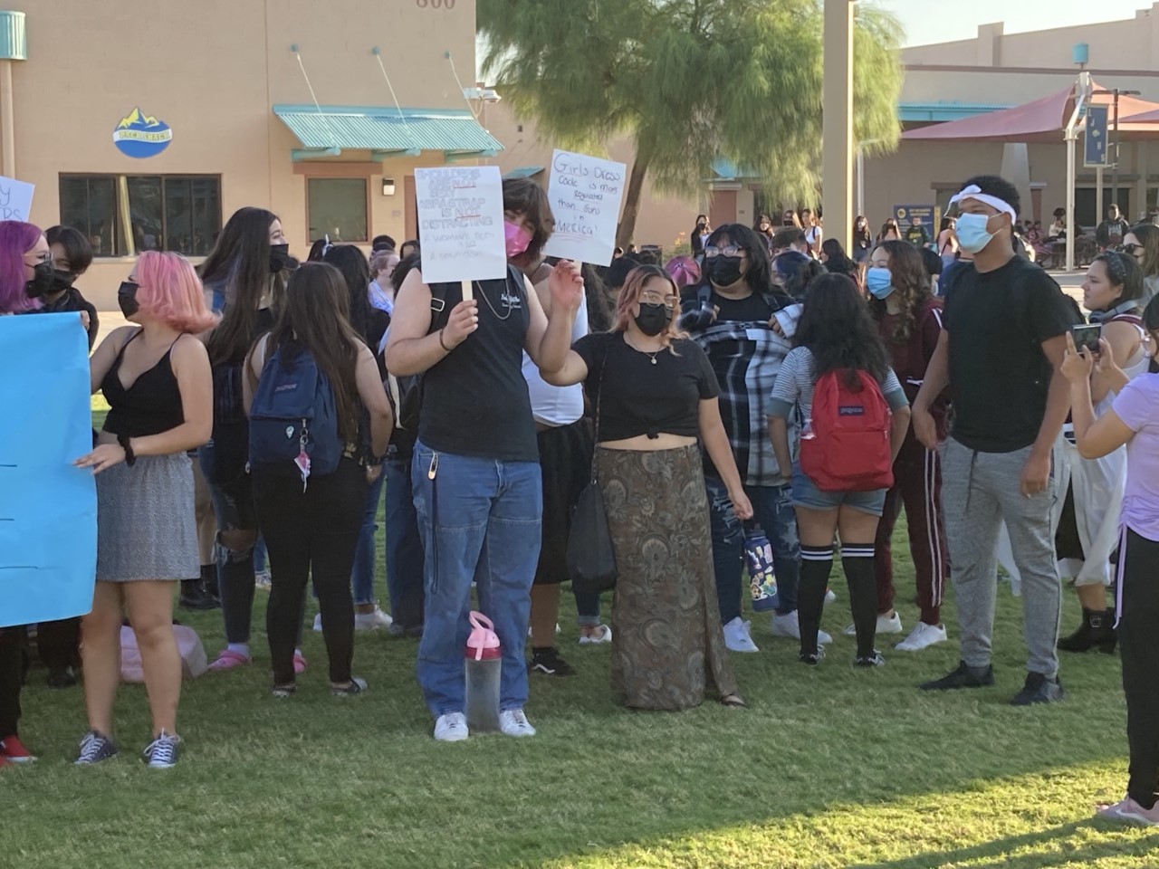 Group of High Schoolers Holding Multiple Feminism Signs in Protest