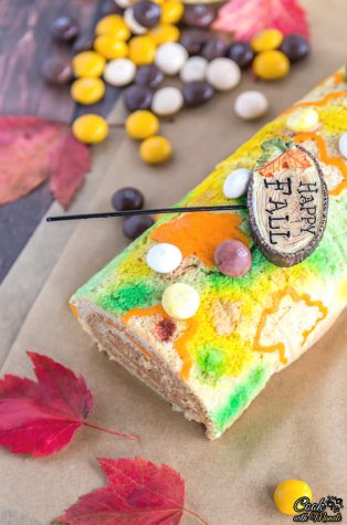 A fall dessert with a small wooden sign laying on top saying happy fall