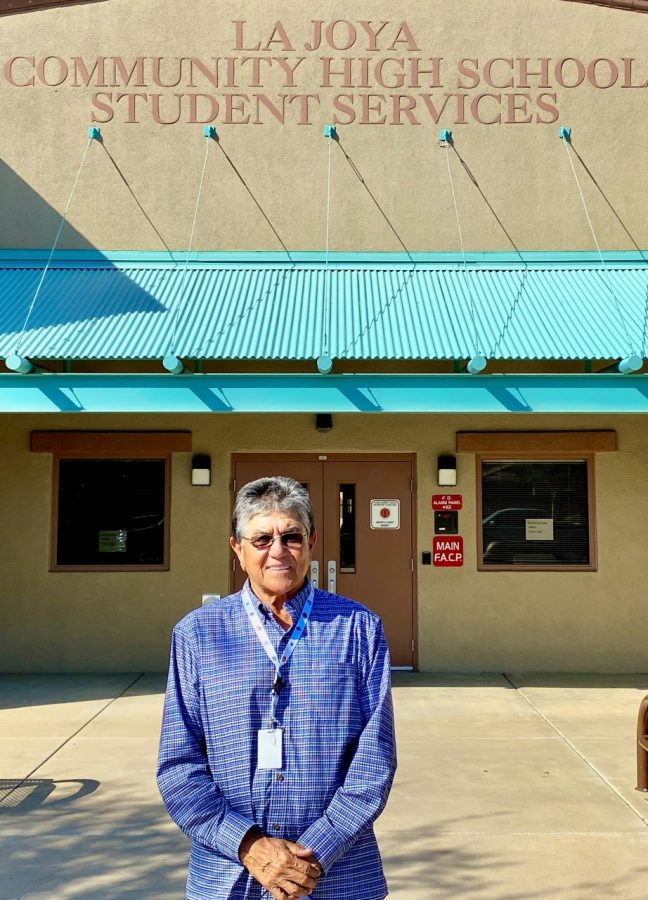Dr. Kino Flores standing in front of La Joya Community High School