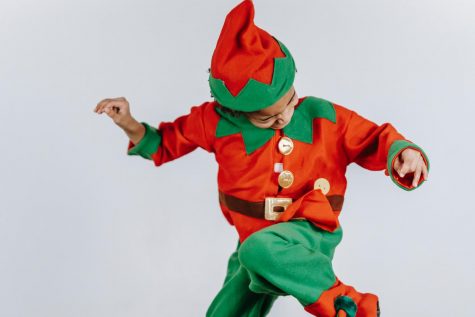 Picture of a boy in an elf costume.