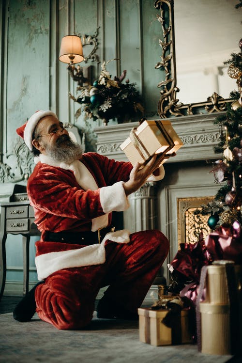 Picture of Santa Clause holding a present